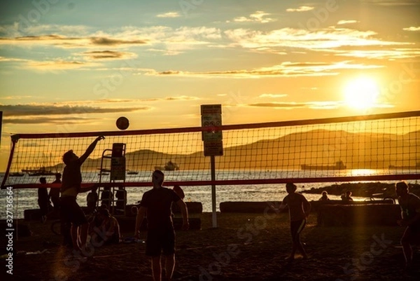 Obraz Beach valleyball players during sunset on a beach in Canada Vancouver British Columbia person scoring 
