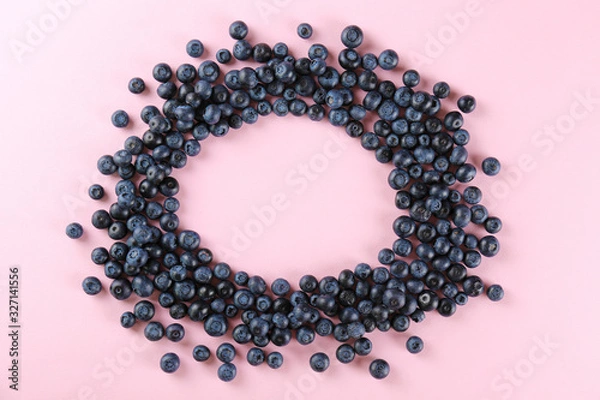 Fototapeta Perfectly ripe freshly picked local produce blueberries. Close up, copy space for text, top view, background. Healthy vegan snacks full of antioxidants. Seasonal summer berries.