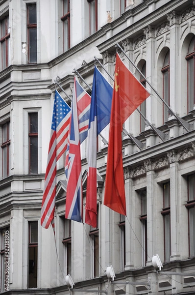 Obraz flags of the of the four victorious powers, the USA, Great Britain, France and the Soviet Union on a house wall in Berlin