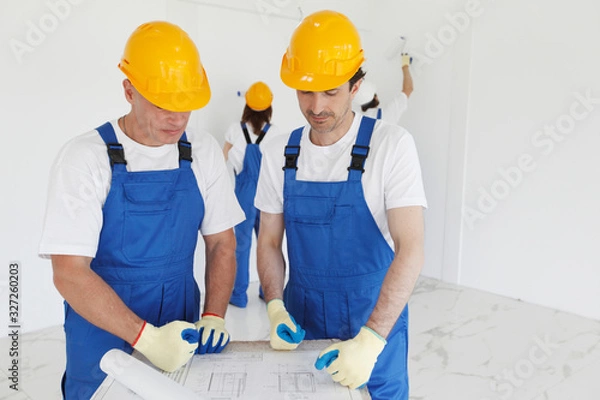Fototapeta Workers at construction site