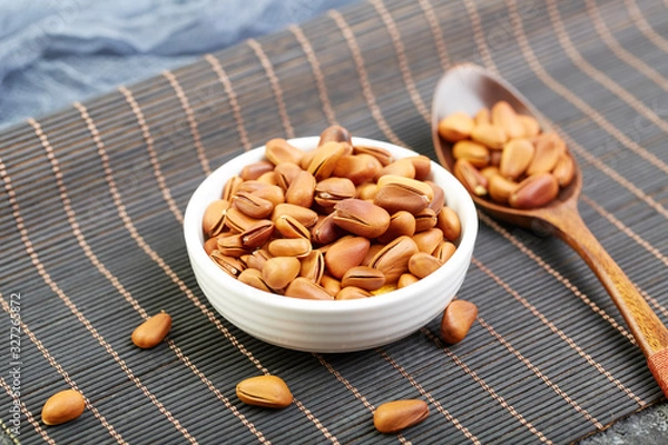 Fototapeta Fried pine nuts