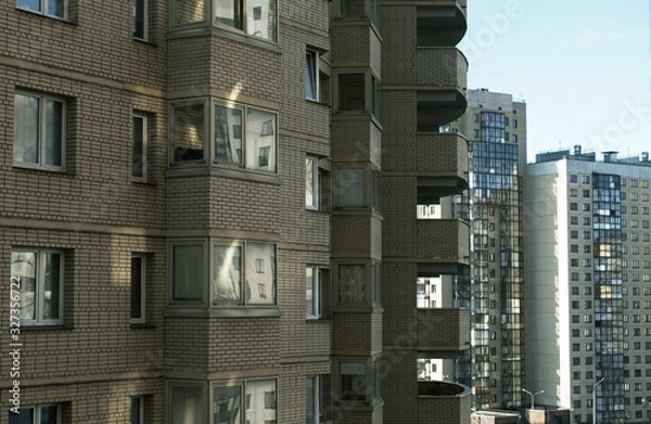 Obraz  Apartment buildings.  Windows and balconies.  Urbanism.  Sunny day.