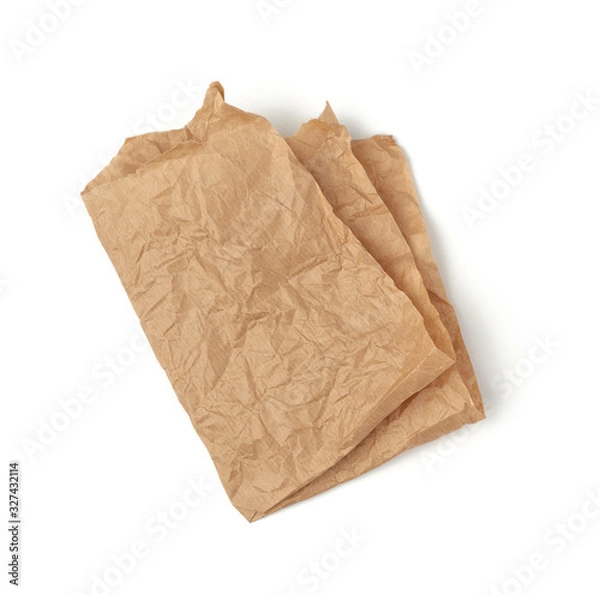 Fototapeta folded piece of crumpled brown paper isolated on white background
