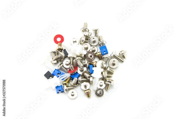 Fototapeta Small bolts, screws and nuts are scattered interspersed with red washers and jumpers in blue and black for the computer. Fasteners for electronics assembly. White isolated background. Close-up.