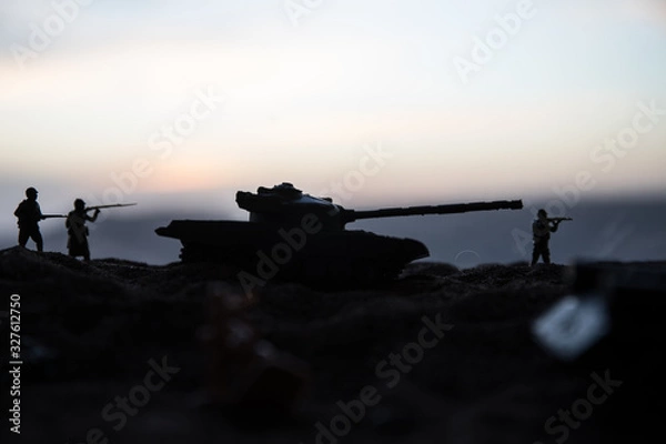 Fototapeta War Concept. Military silhouettes fighting scene on war fog sky background, World War Soldiers Silhouette Below Cloudy Skyline At sunset.