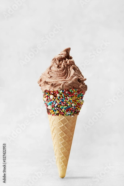 Fototapeta Ice cream cone isolated on a neutral grey background. Copy space