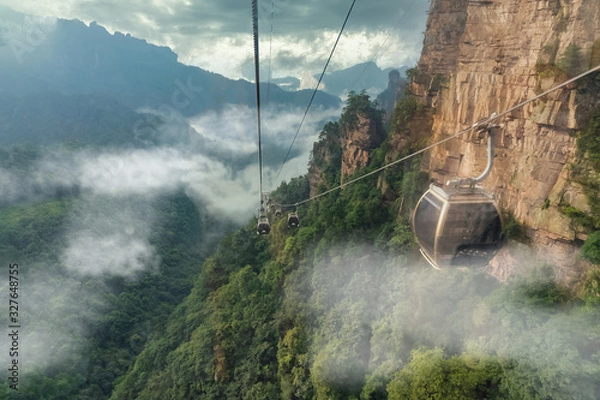 Obraz Cable crossing Tianzi Mountain and Yellow Stone Stronghold (Huangshi Zhai) in Yuanjiajie Scenic Area , Zhangjiajie National Park, China