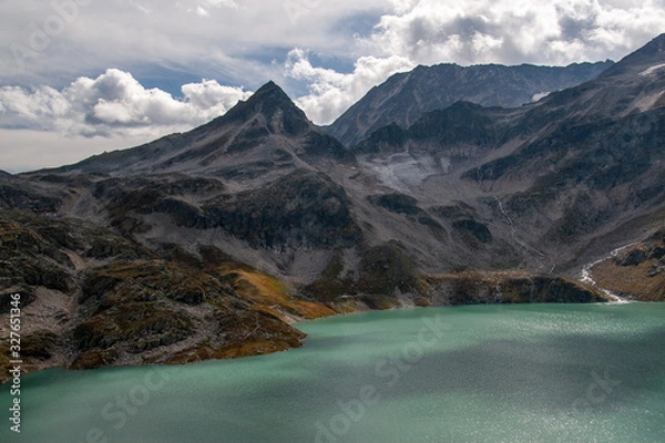 Obraz View of the Alpine glacier swaying into the mountain turquoise lake