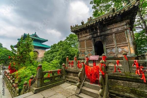 Obraz Beautiful and charming ancient architecture in front of Tianmen gate. Small temple and watchtower in Nanyan Palace. Wudang Shan Mountain, China (text: use of precious cultural relics is forbidden)