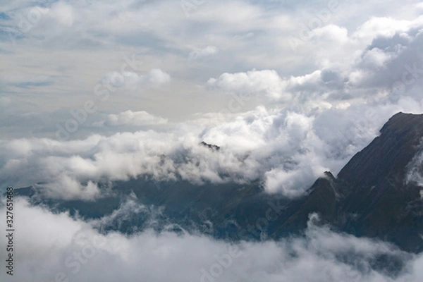 Obraz Gorgeous scenery of alpine peaks shrouded in clouds