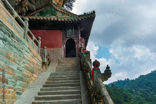 Obraz Danan Rock scenic spot. Temple with burning dragon head incense in Liangyi, Nanyan Palace. Wudang Mountain, Hubei province, China (text: Liangyi building)
