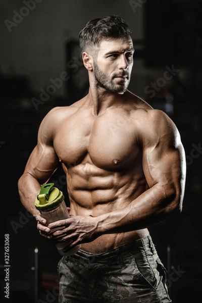 Fototapeta Bodybuilder athletic man workout muscles exercise.