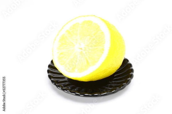 Obraz Lemon on black plate
