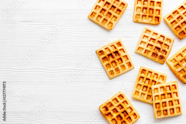 Fototapeta Waffles frame on white background top-down copy space