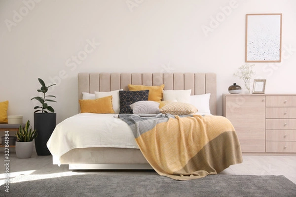 Obraz Stylish interior of contemporary room with comfortable bed