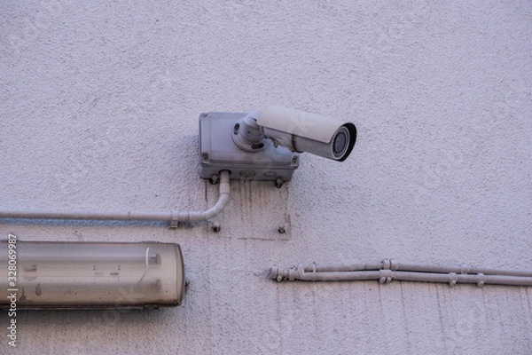Fototapeta cctv security camera on the wall 