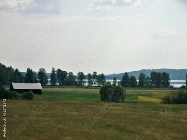 Fototapeta panorama of lake with blue sky and clouds, Finland