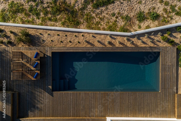 Fototapeta Aerial view of modern villa with pool and deck