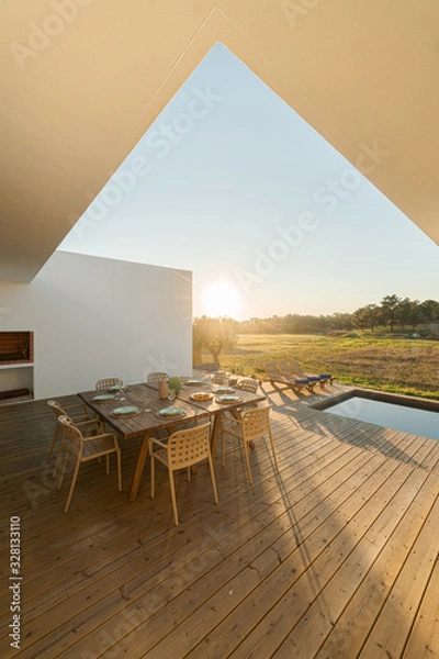 Fototapeta Dinner table setting in modern villa terrace
