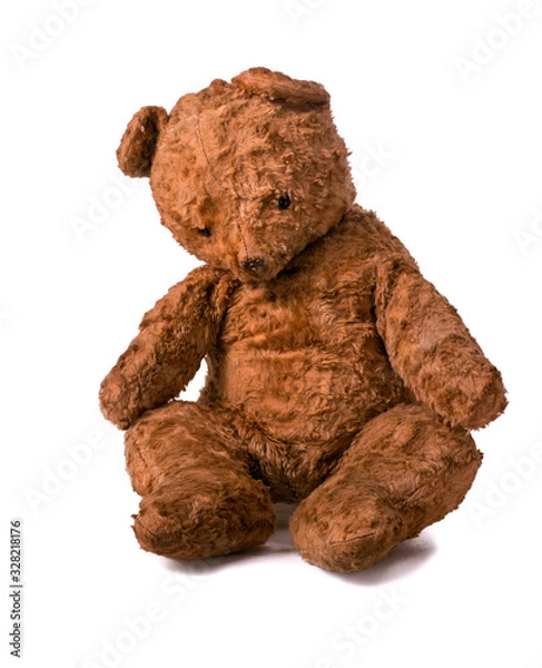 Obraz Unsightly sad vintage teddy bear. sitting on a white background.