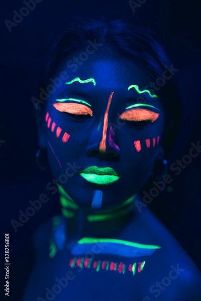 Fototapeta Uv paint make-up on woman's face