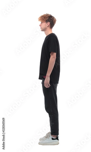 Fototapeta side view. a young man in a black t-shirt.