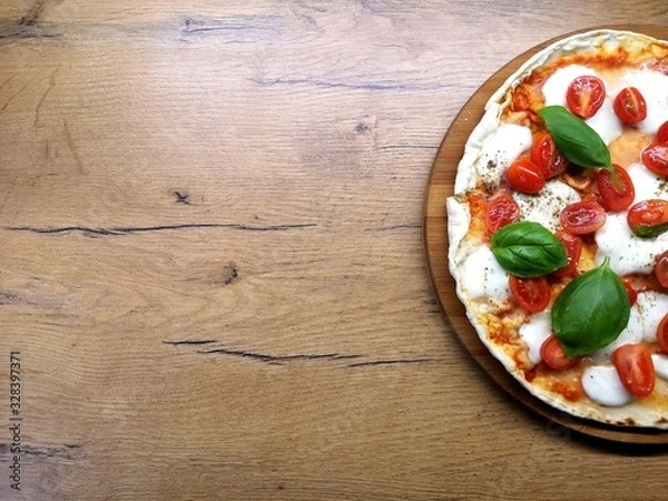 Obraz pizza on wooden table