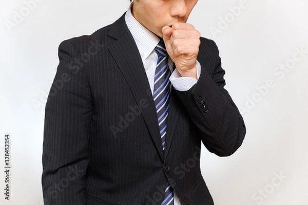 Obraz 咳をするスーツ姿の男性