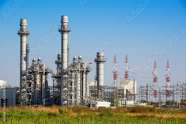 Obraz Power plant station building and industrial pipe system on blue sky background