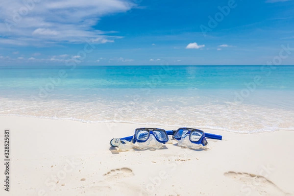 Fototapeta Summer sport, beach activity, beach recreational concept. Diving goggles and snorkel gear on white sand near beach. Summer vacation and recreational travel background