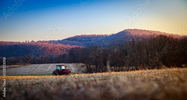 Fototapeta Field with tractor