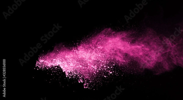 Obraz Pink powder explosion on black background. Colored cloud. Colorful dust explode. Paint Holi.