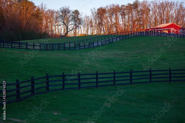 Fototapeta Barn side view with sunset