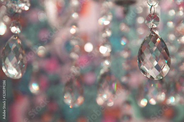 Fototapeta Festive background with sparkling crystal chandelier pendants