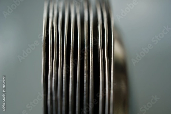 Fototapeta Bunch of Metallic Platters Placed Vertically