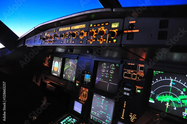 Obraz Flight deck of an Airbus A 320 in flight at night taken from the first officer seat