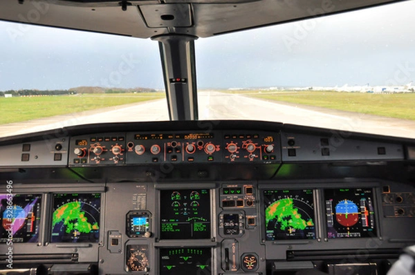 Obraz Cockpit shot taken from the jump seat of an Airbus A320 landing in Paris Orly during a stormy weather with visible weather returns on the radar