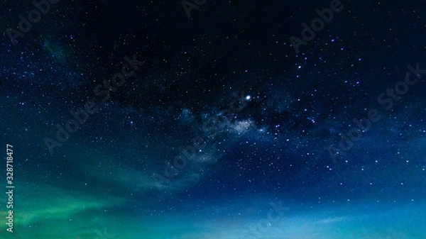 Fototapeta Milky way galaxy with stars and space in the universe background at thailand