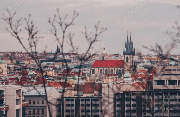 Obraz Moody Photo of Prague panorama with medieval church and red roofs taken from Letná hill on the moody February afternoon