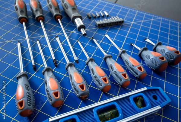 Obraz  Screwdriver Set on Blue Stationary Mat Two