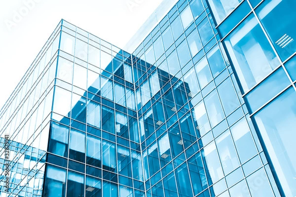 Fototapeta low angle view to light glass buildings of business center