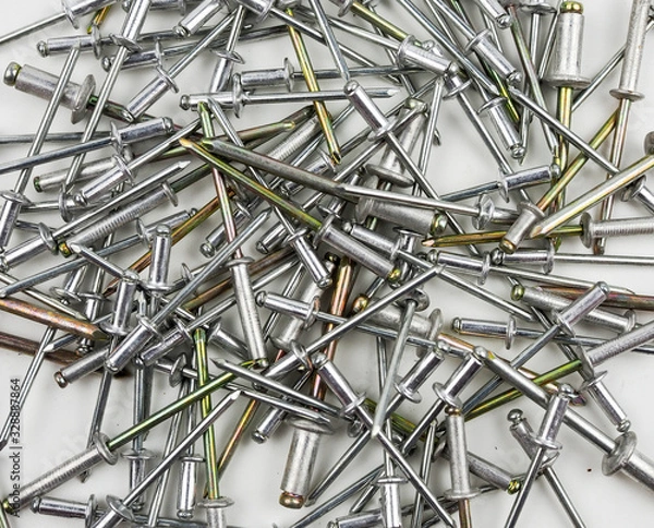 Obraz Silver blind rivet screw rivets for hand riveters on white background.