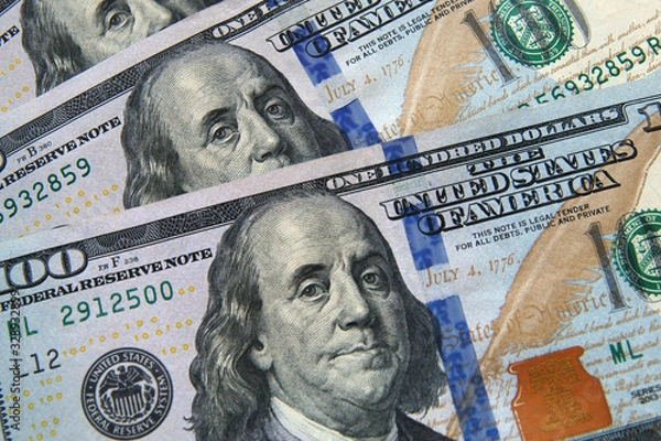 Fototapeta Background of one-hundred- dollar American bills top view