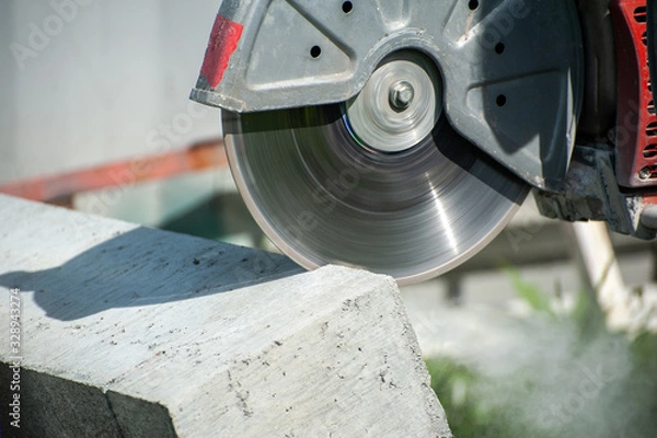 Fototapeta Fragment of a joint cutter on a brushed concrete surface.