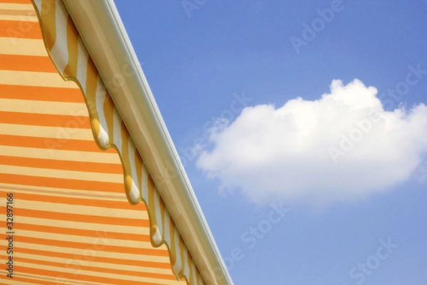 Obraz Sonnenmarkise vor blauem Himmel