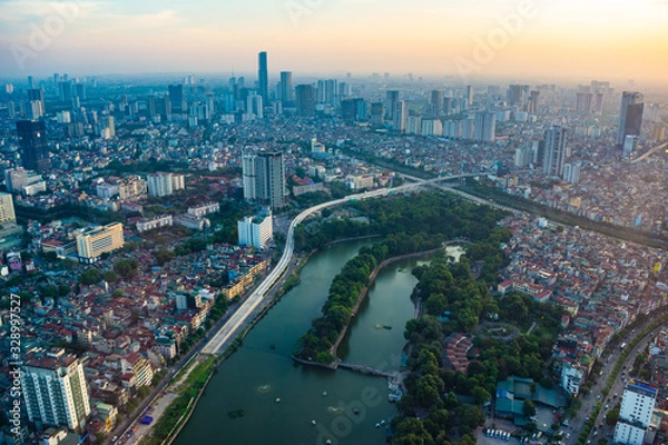 Fototapeta Hanoi, Vietnam - 22th June 2019: Hanoi cityscape at sunset, from Lotte Observation Deck in Lotte Center, Hanoi.