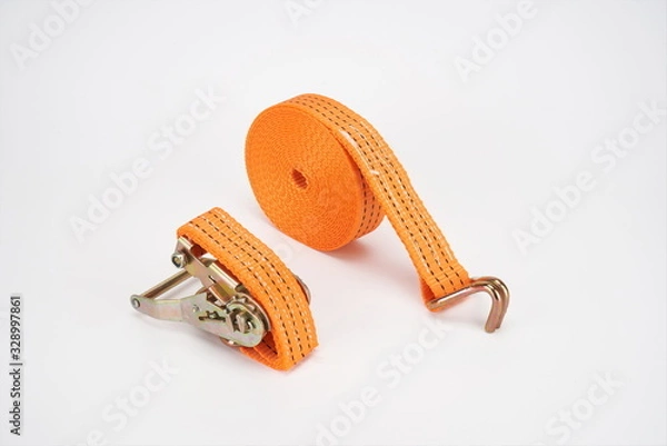 Fototapeta The sling for fastening cargoes is isolated on a white background.tie down strap ratchet