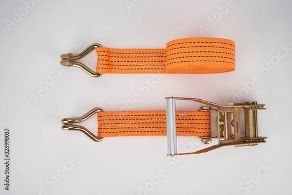 Fototapeta The sling for fastening cargoes is isolated on a white background.tie down strap ratchet