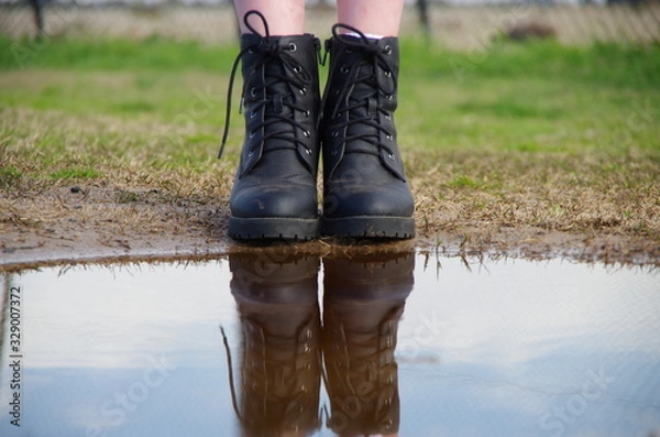 Obraz Boots near puddle