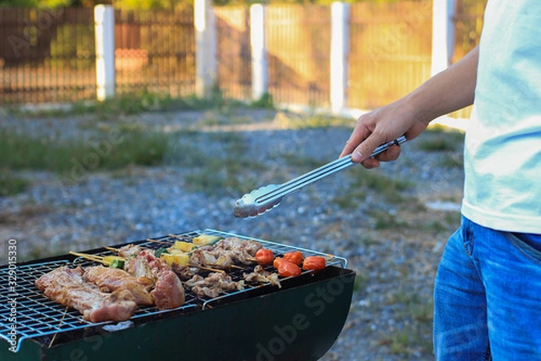 Fototapeta Barbeque Grill Street Food in thailand,Eat outdoors in a happy family.